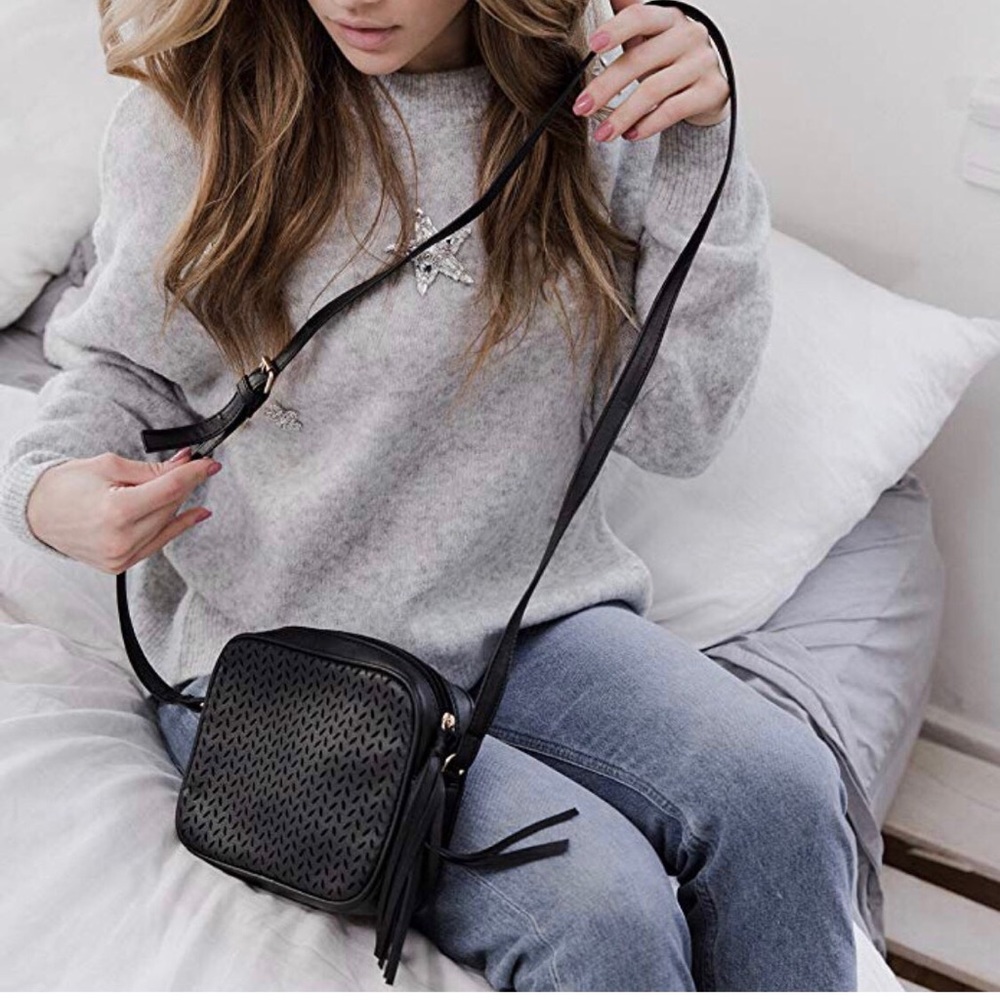 SOLD Crossbody purse with gold a tassel detail